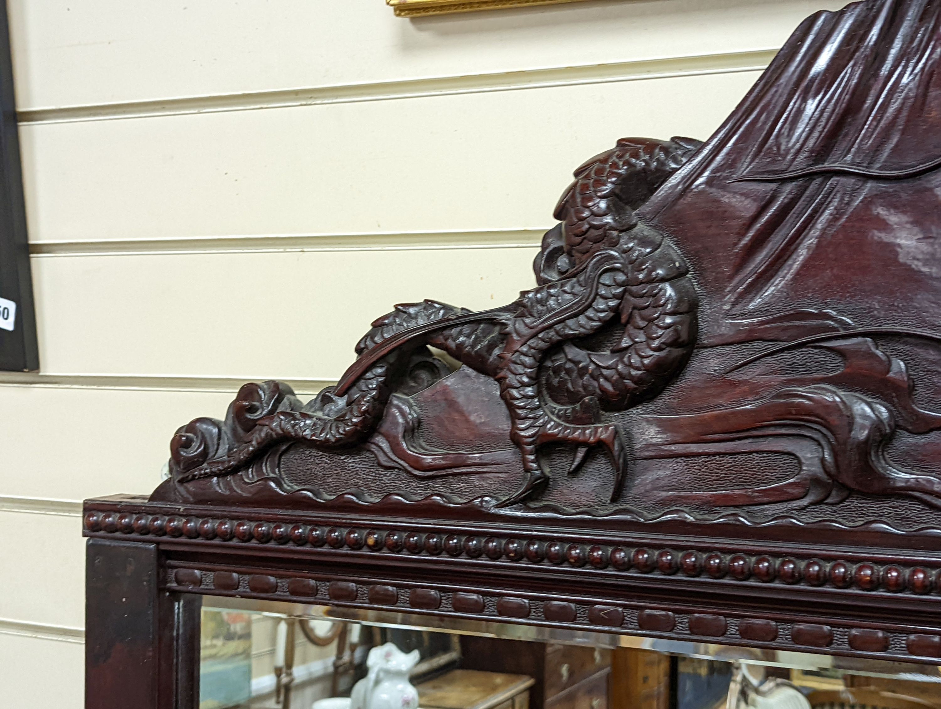 A Japanese carved hardwood dragon overmantel mirror, width 112cm, height 180cm